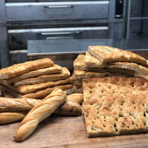 Bread and focaccia on prep table